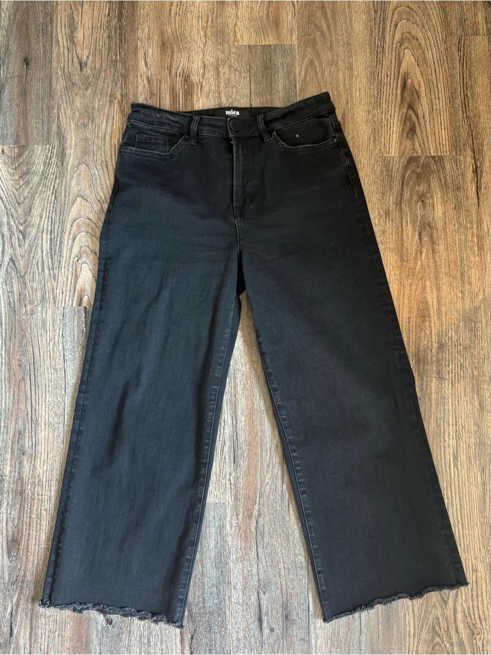 Black Wide-Leg Jeans with Raw Hem —